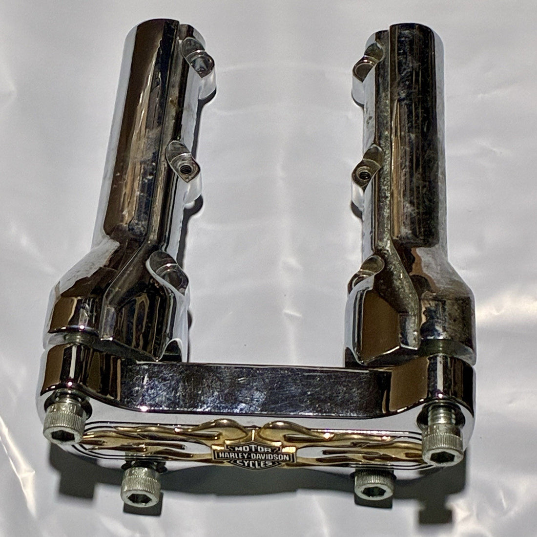 
  
  HARLEY-DAVIDSON GOLD FLAME BAR & SHIELD RISER WITH CLAMP OEM
  

