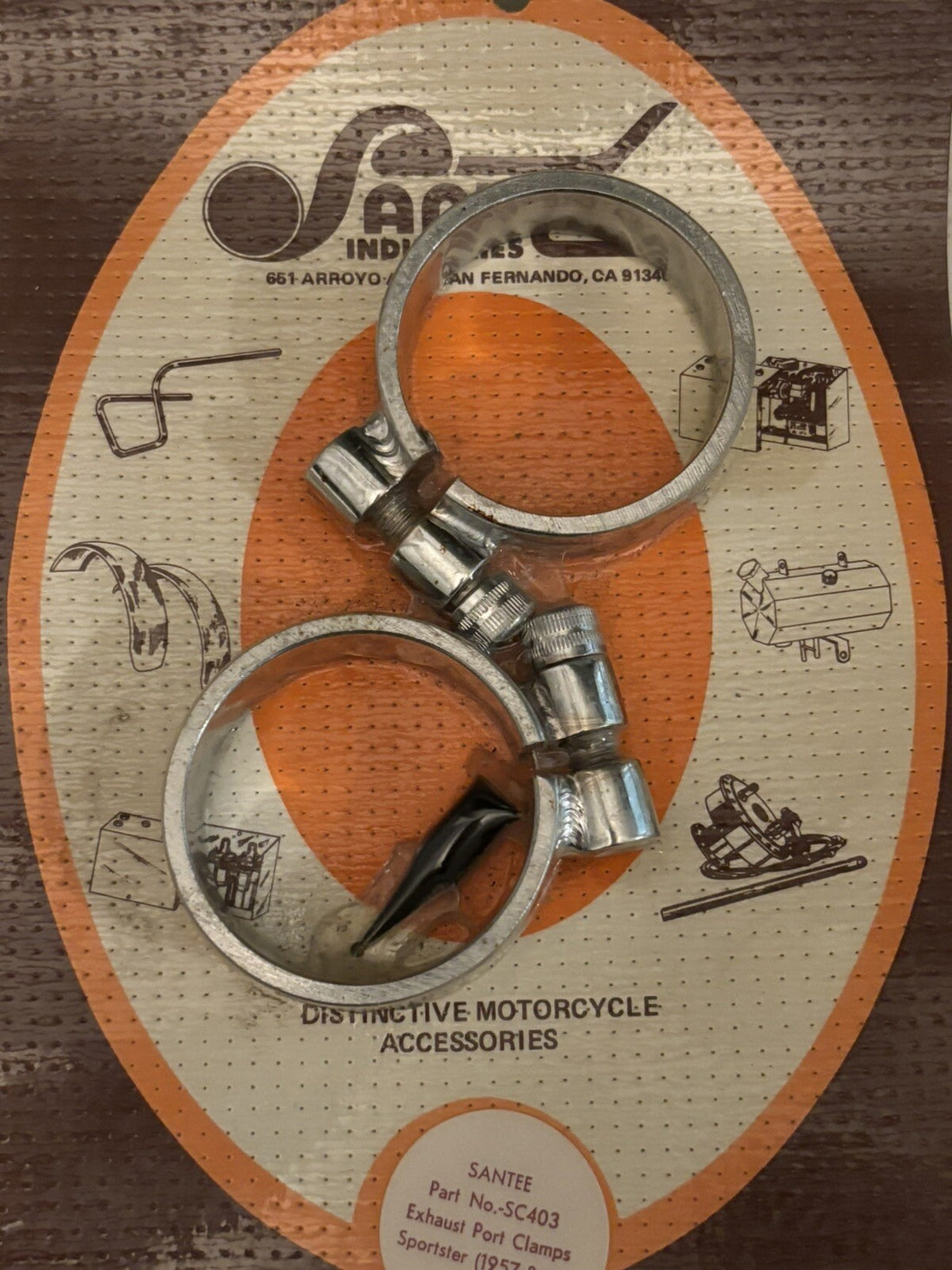 
  
  SC403 SANTEE EXHAUST PORT CLAMPS 1957-UP XL SPORTSTER HARLEY NOS
  
